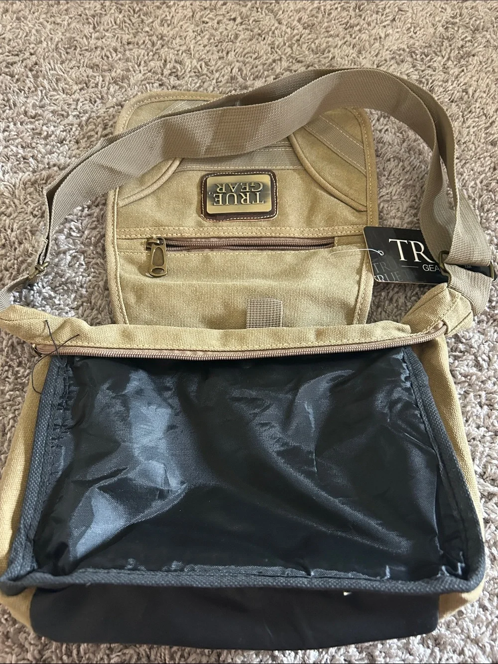 Tan/khaki  Messenger crossbody Bag with Adjustable Strap. Waterproof liner